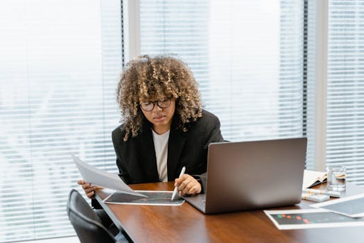 person analyzing data on a tablet